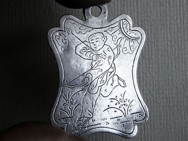 Amulet showing a boy armed with a bow – (0287)